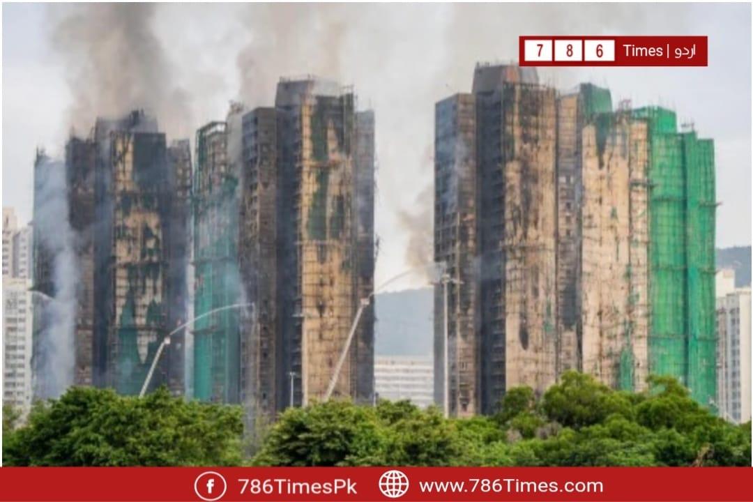 Charred Wang Fuk Court high-rise towers after 2025 Hong Kong fire.